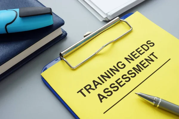 training needs assessment report on a clip board